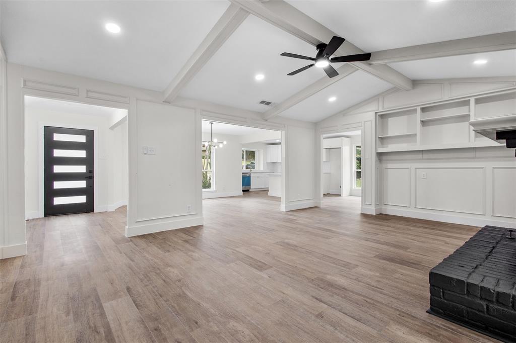 2816 Quail Ridge Drive Carrollton, TX 75006 - Photo 6 of 33 Unfurnished living room with light wood-style floors, a chandelier, a ceiling fan, and recessed lighting