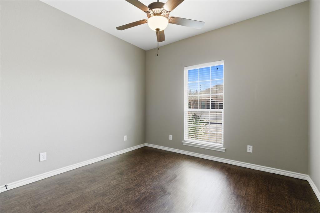 711 Hadley Lane Valley View, TX 76272 - Photo 13 of 40 Spare room with a ceiling fan and dark wood finished floors