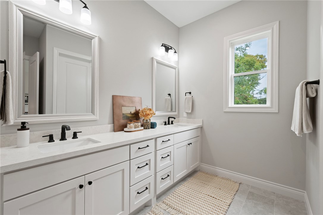 13291 Hopes Creek Road College Station, TX 77845 - Photo 15 of 45 Full bathroom with double vanity and light tile patterned floors