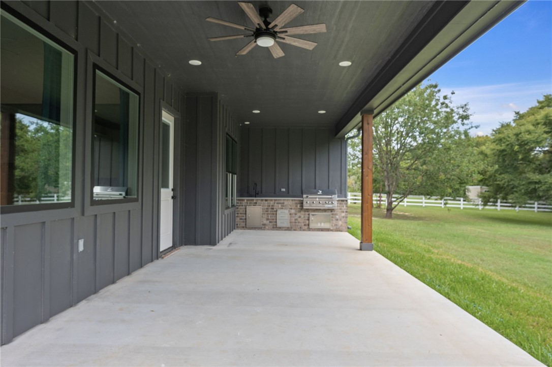 13291 Hopes Creek Road College Station, TX 77845 - Photo 32 of 45 View of patio with ceiling fan and exterior kitchen