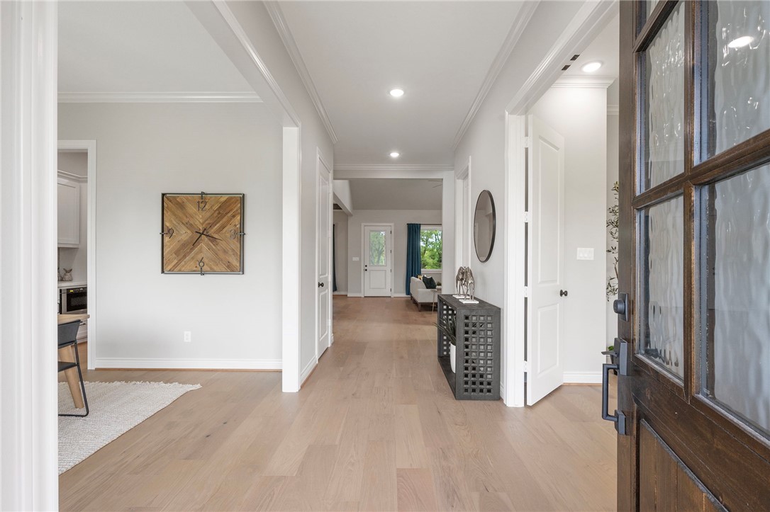 13291 Hopes Creek Road College Station, TX 77845 - Photo 7 of 45 Entryway with light wood finished floors, crown molding, and recessed lighting