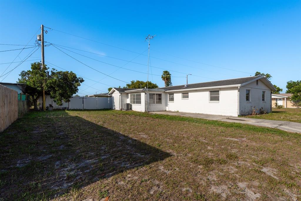 3706 Cambridge Street New Port Richey, FL 34652 - Photo 3 of 29 HUGE BACK YARD FOR RV OR BOAT STORAGE!
