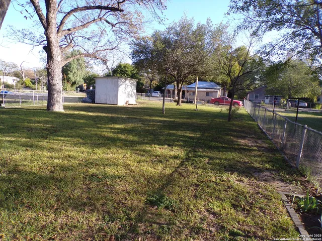 a view of a fountain in front of a house