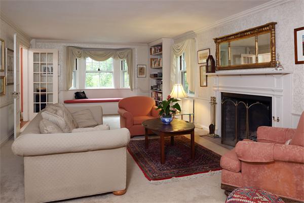10 Concord Road Wayland, MA 01778 - Photo 3 of 6 a living room with furniture and a fireplace