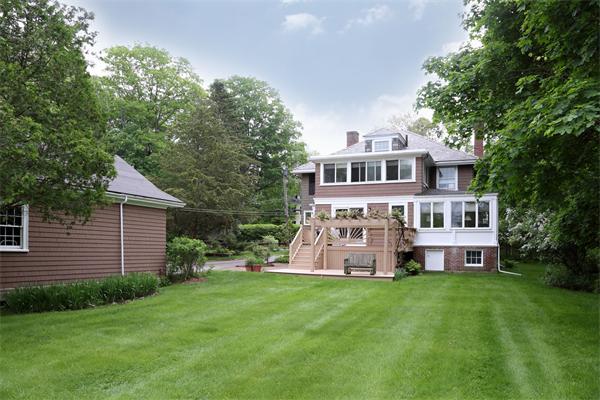 10 Concord Road Wayland, MA 01778 - Photo 5 of 6 a front view of a house with garden and trees