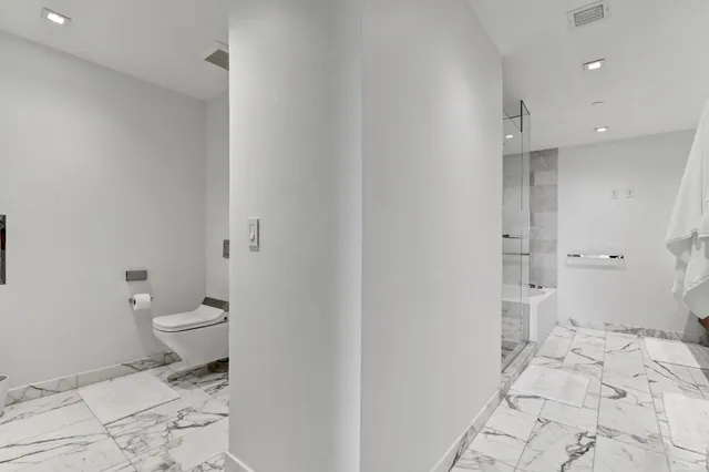 a large bathroom with a double vanity sink and mirror