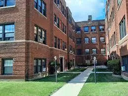 a view of a building with a yard