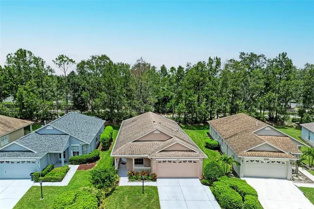 an aerial view of house with yard