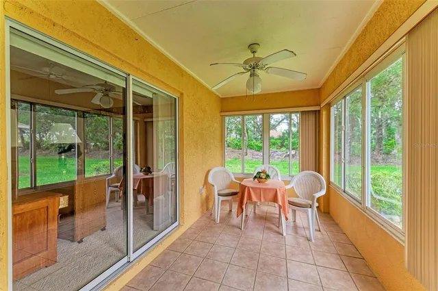 a dining room with large windows
