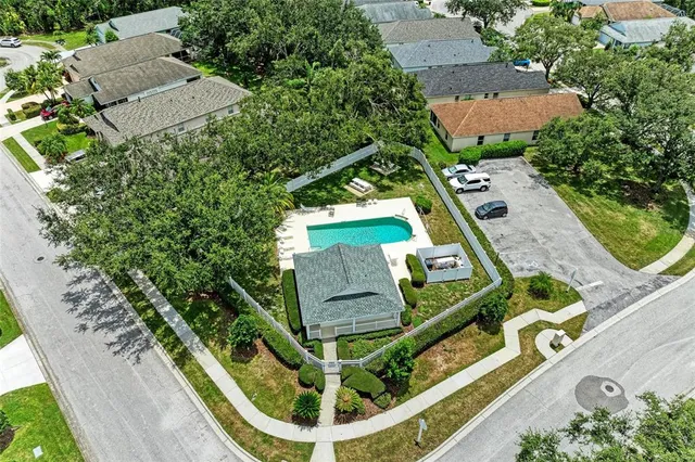 an aerial view of a house with a garden