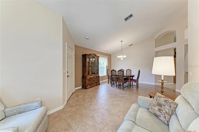 a living room with furniture and a table