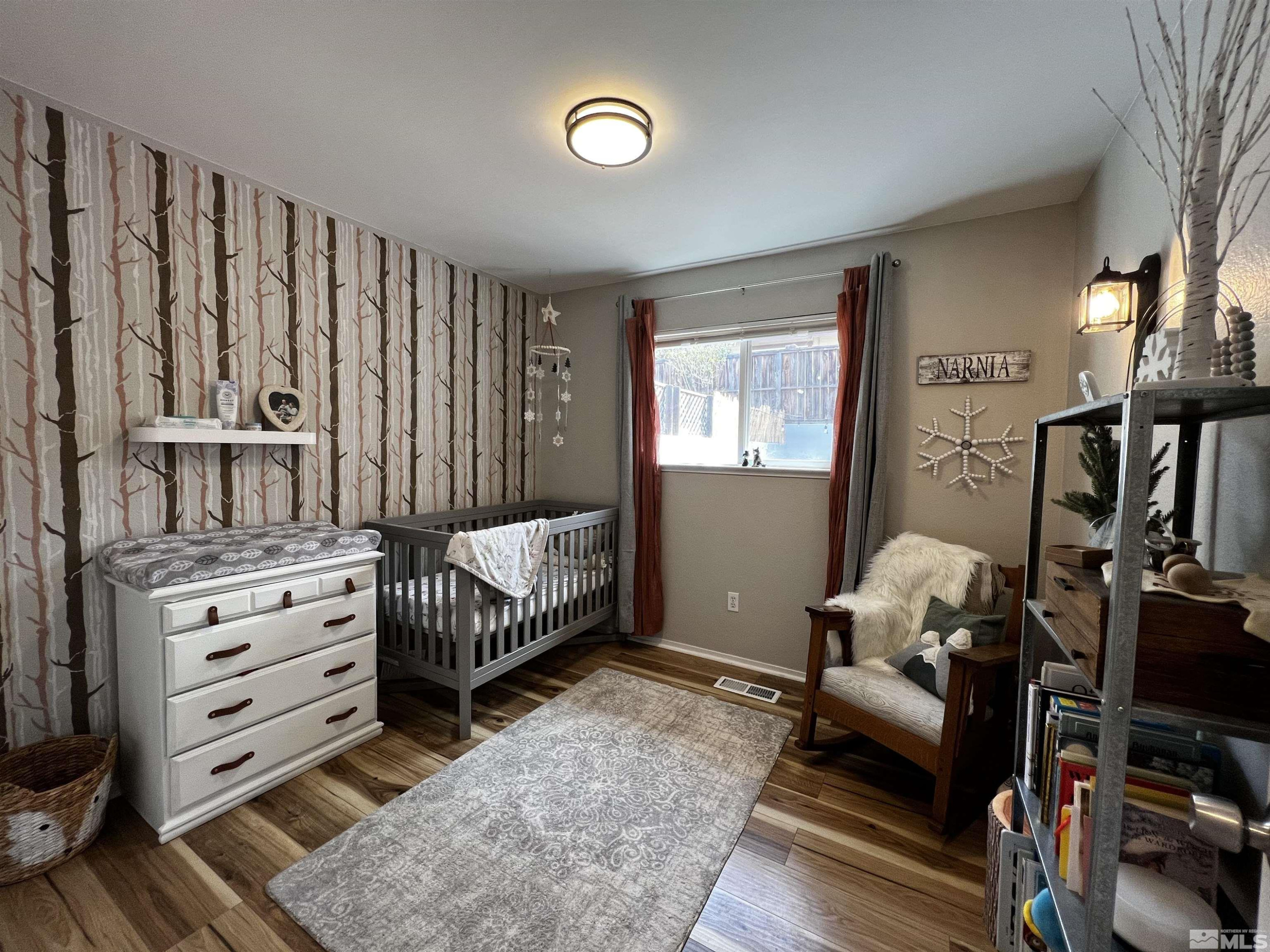 6412 Flower Street Reno, NV 89506 - Photo 26 of 38 a bedroom with furniture and a window