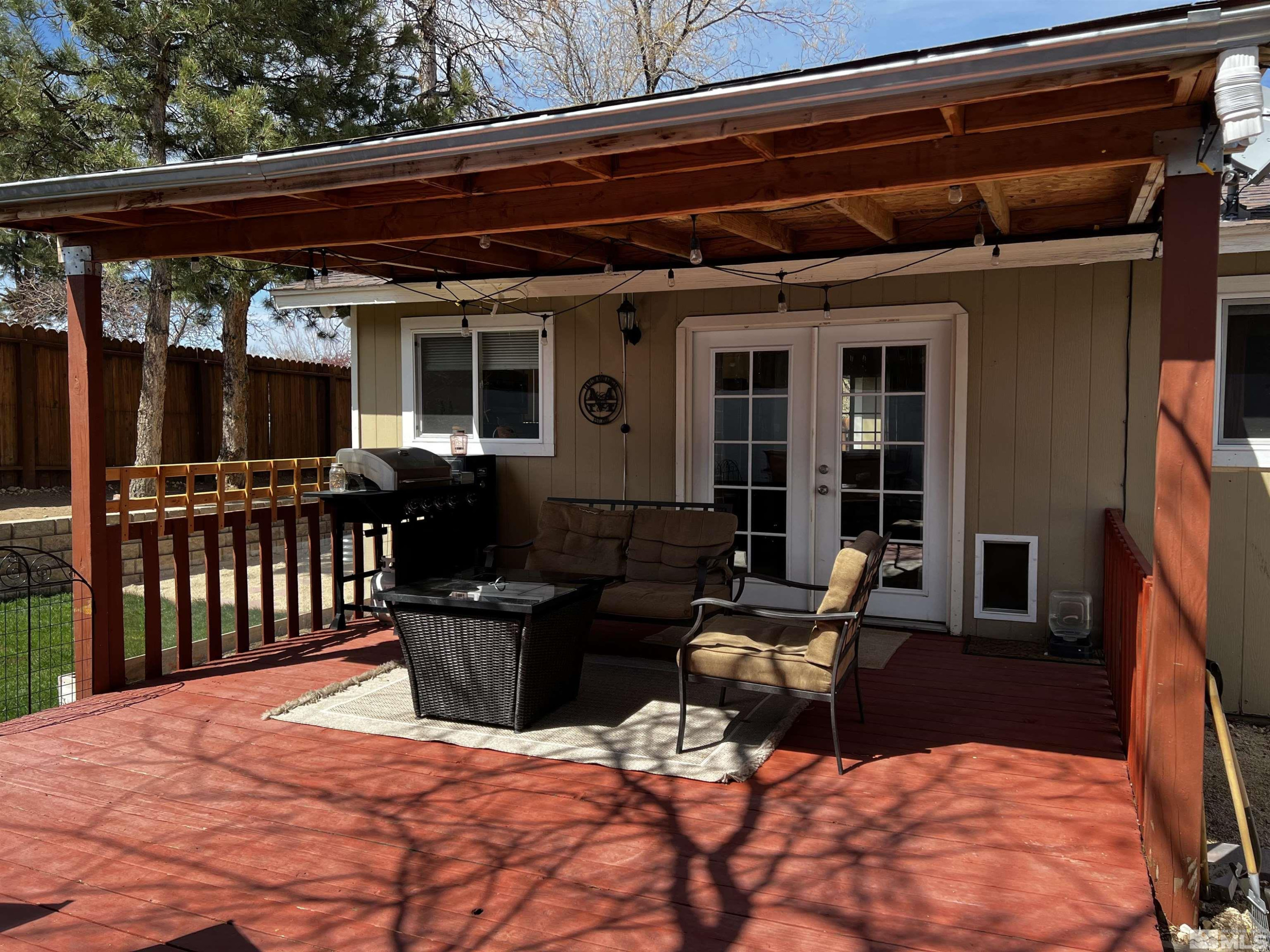 6412 Flower Street Reno, NV 89506 - Photo 29 of 38 a view of a deck with table and chairs
