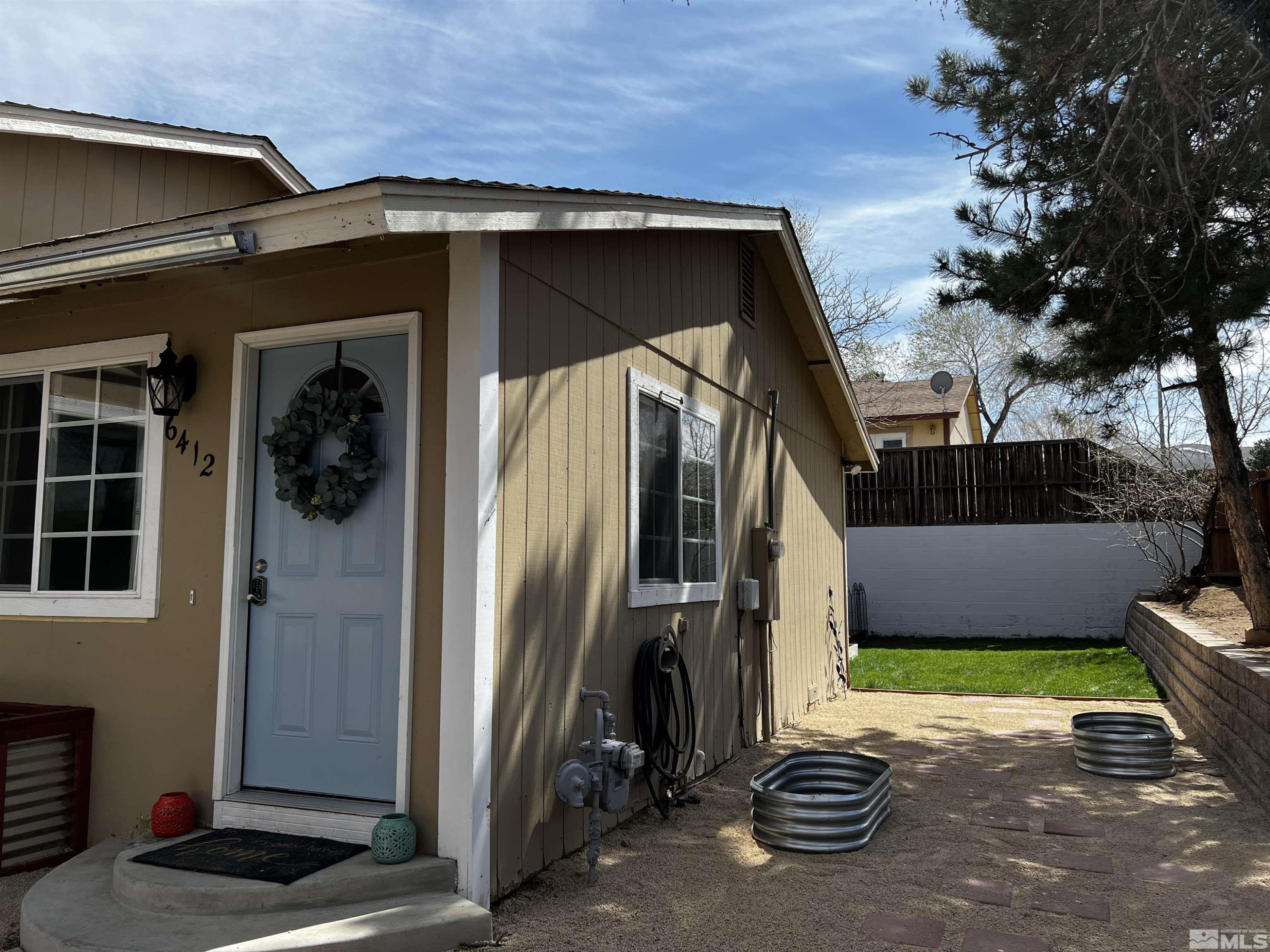6412 Flower Street Reno, NV 89506 - Photo 34 of 38 a view of front door and small yard