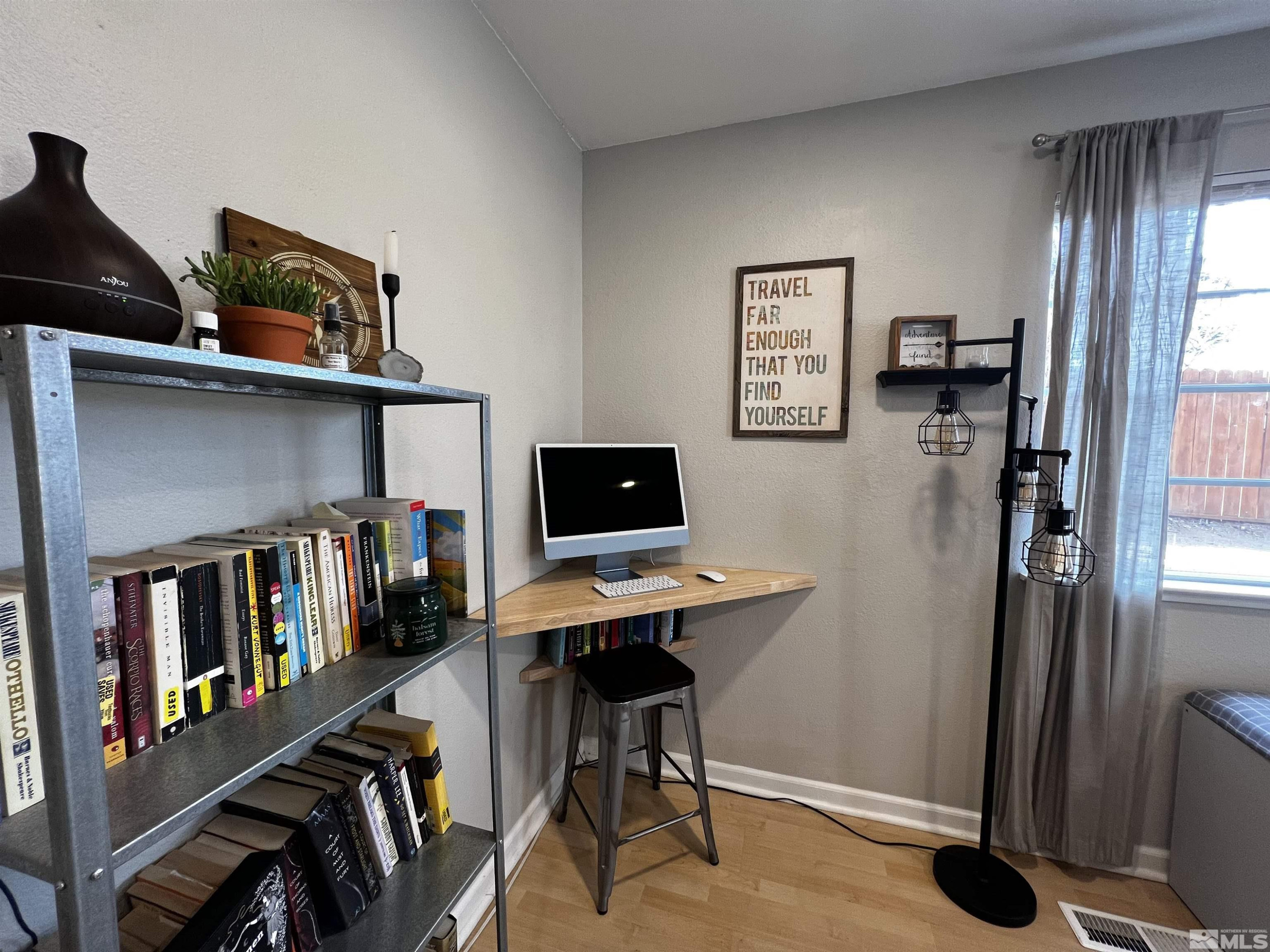 6412 Flower Street Reno, NV 89506 - Photo 5 of 38 a view of a workspace with furniture and a window