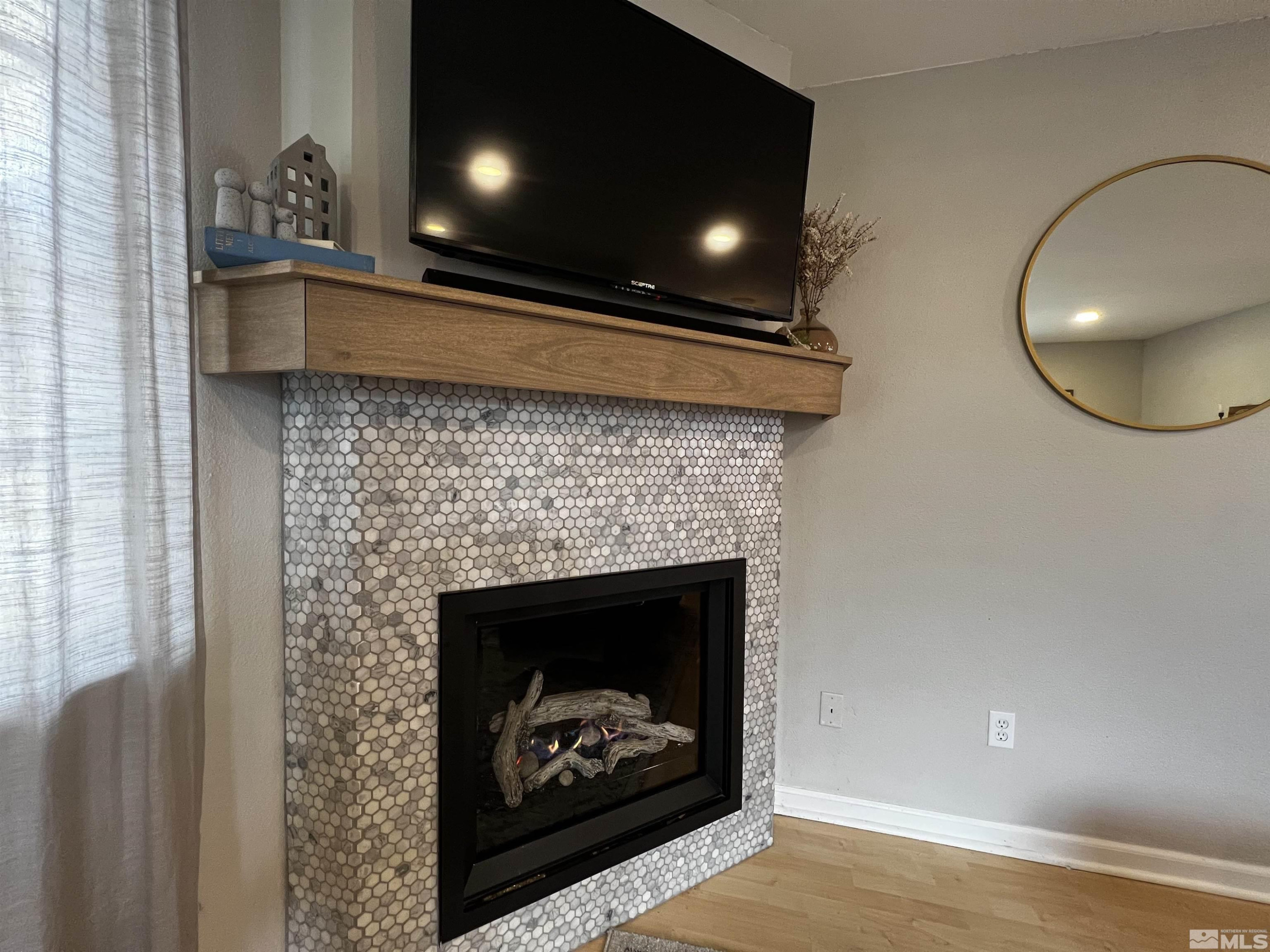 6412 Flower Street Reno, NV 89506 - Photo 6 of 38 a living room with furniture and a fireplace