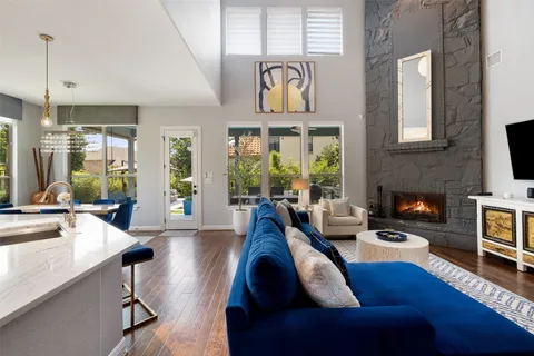 a living room with furniture fireplace and flat screen tv
