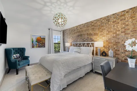 a bedroom with a bed and a table in it