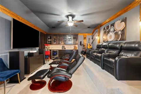 a room with gym equipment and a flat screen tv