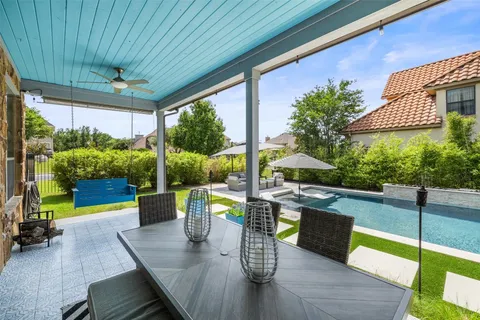 a dining room with furniture and a garden