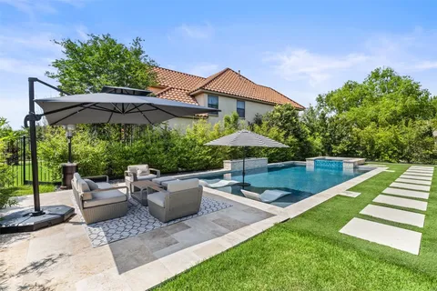 a patio with a patio table and chairs