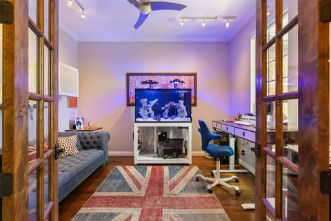a living room with furniture a rug and a fireplace