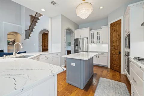 a room with sink and mirror