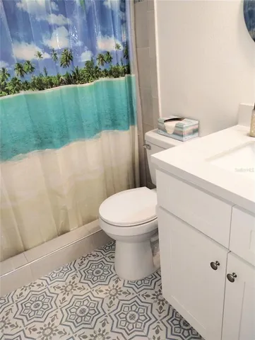 a bathroom with a toilet and a garden
