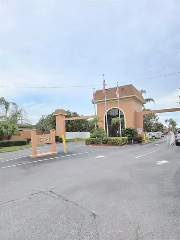 a view of a city street with a building in the background