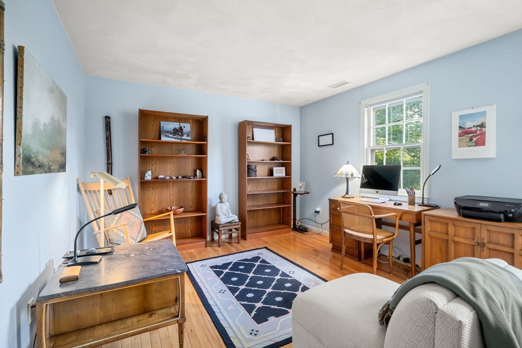 10 Apple Ridge Road, Unit 4 Maynard, MA 01754 - Photo 19 of 27 a room with furniture a rug and wooden floor
