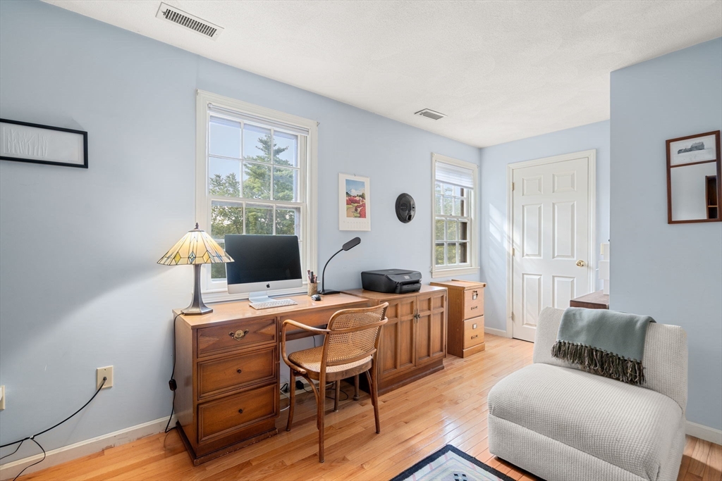 10 Apple Ridge Road, Unit 4 Maynard, MA 01754 - Photo 20 of 27 a bedroom with furniture and a window