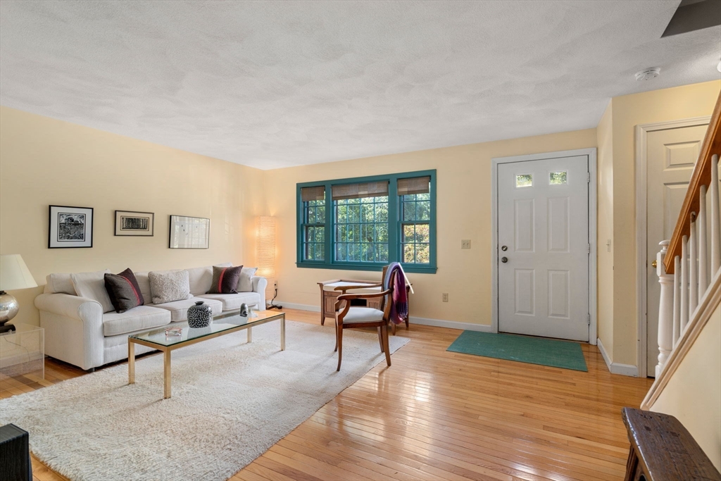 10 Apple Ridge Road, Unit 4 Maynard, MA 01754 - Photo 2 of 27 a living room with furniture and a window