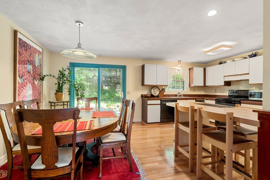 10 Apple Ridge Road, Unit 4 Maynard, MA 01754 - Photo 8 of 27 a view of a dining room with furniture window and wooden floor