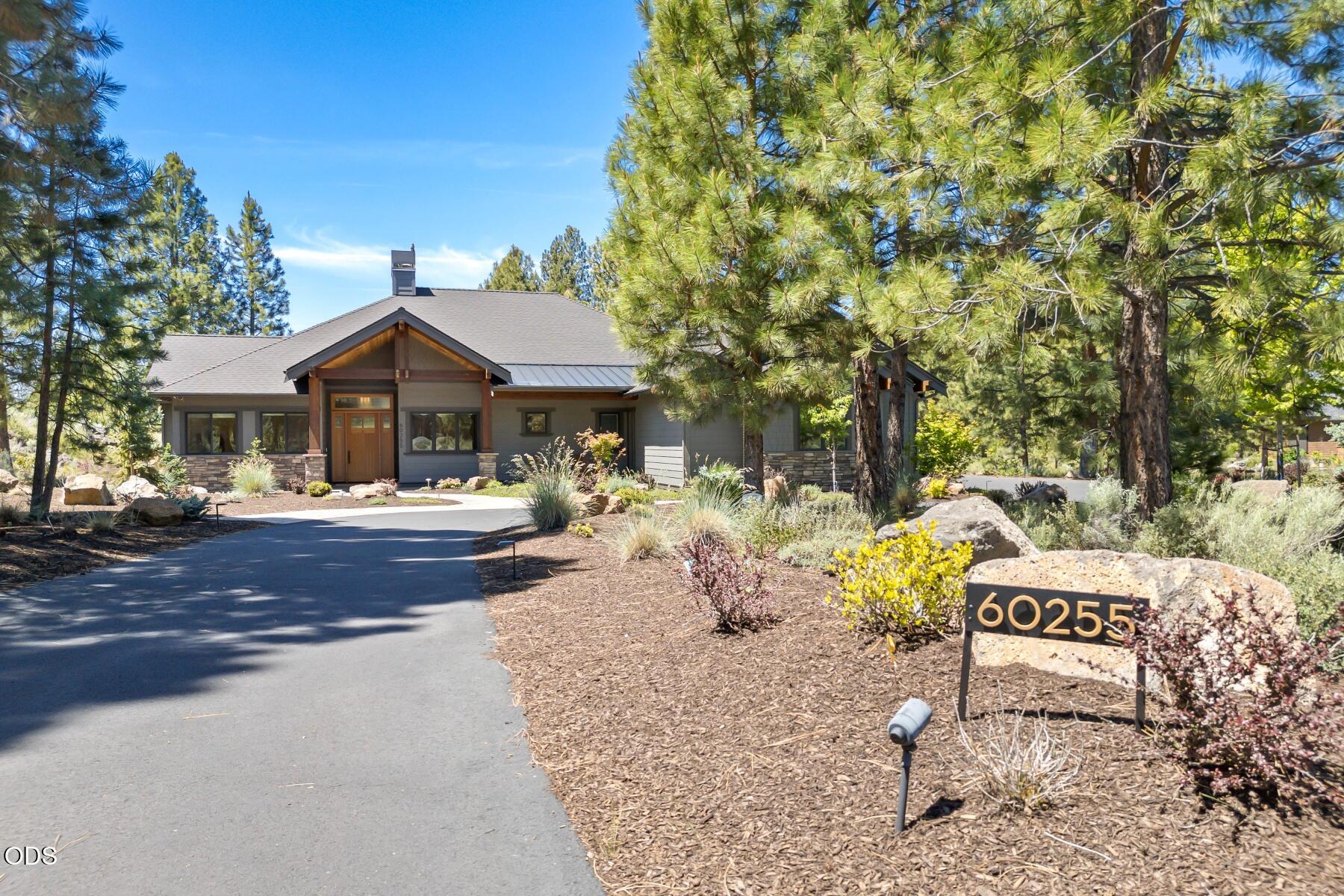 60255 Sunset View Drive Bend, OR 97702 - Photo 2 of 48 a front view of a house with a yard