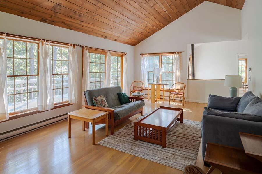 45 Old Long Pond Road Wellfleet, MA 02667 - Photo 14 of 47 a living room with furniture and a large window