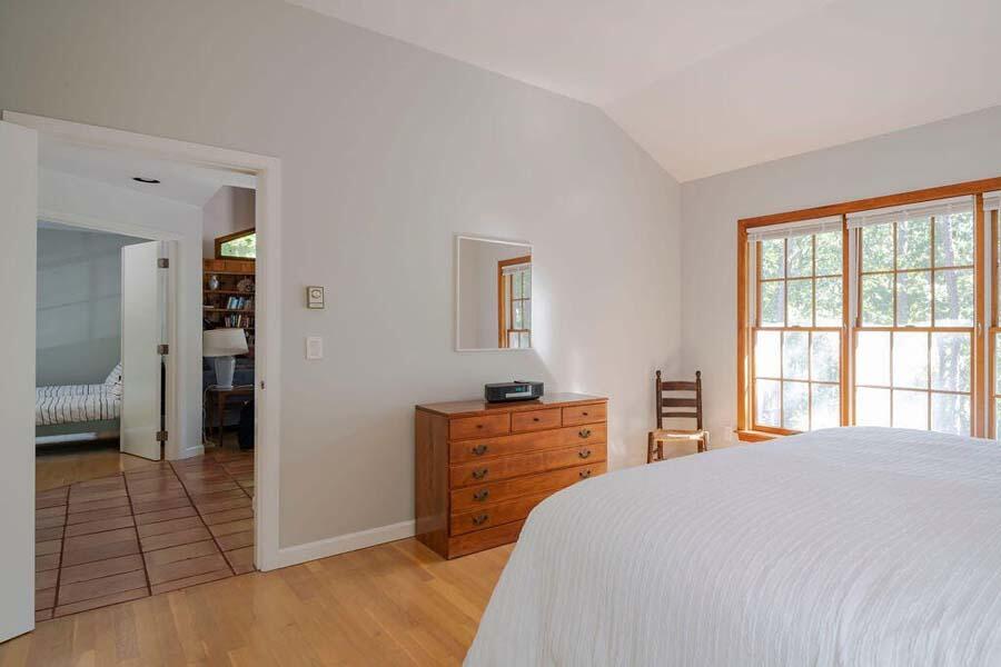 45 Old Long Pond Road Wellfleet, MA 02667 - Photo 24 of 47 a bedroom with a bed and a dresser