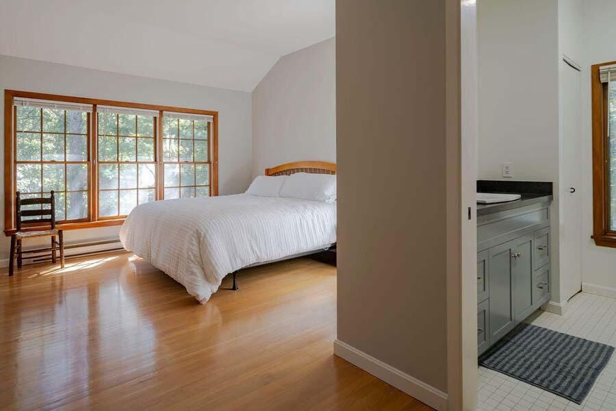45 Old Long Pond Road Wellfleet, MA 02667 - Photo 25 of 47 a bedroom with a bed and wooden floor