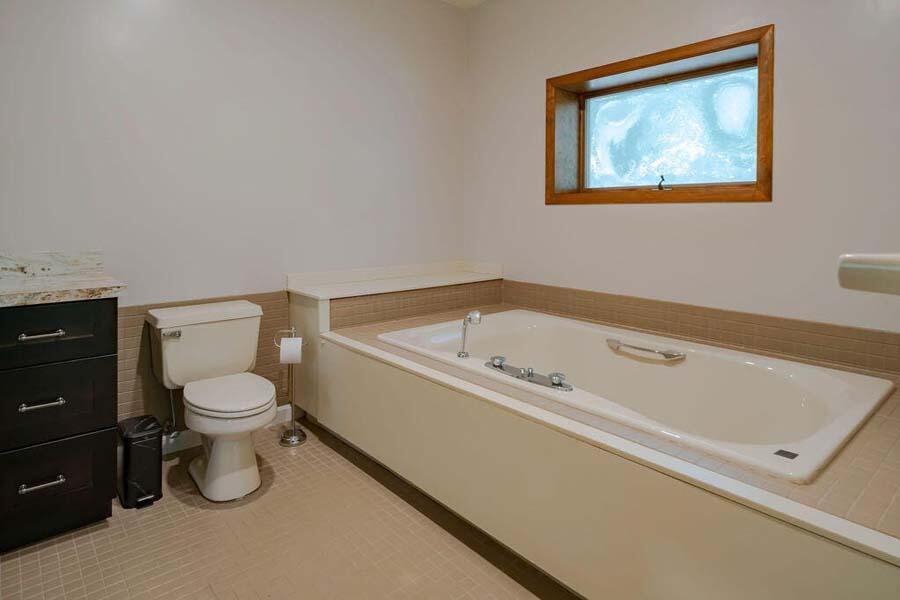 45 Old Long Pond Road Wellfleet, MA 02667 - Photo 26 of 47 a bathroom with a toilet and a bathtub