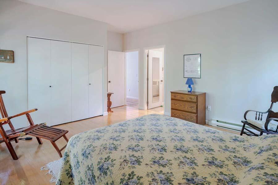45 Old Long Pond Road Wellfleet, MA 02667 - Photo 32 of 47 a bedroom with a bed and a dresser in it