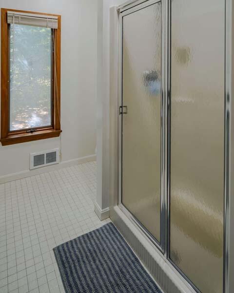 45 Old Long Pond Road Wellfleet, MA 02667 - Photo 34 of 47 a view of a bathroom with a glass shower door