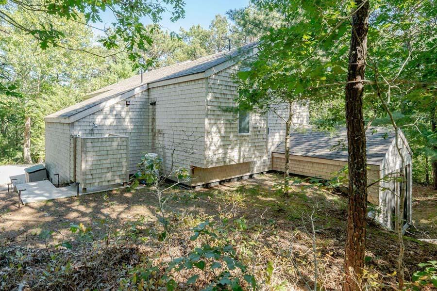 45 Old Long Pond Road Wellfleet, MA 02667 - Photo 38 of 47 a backyard of a house with seating space