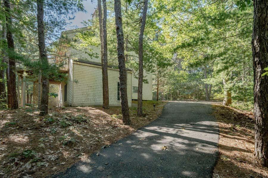 45 Old Long Pond Road Wellfleet, MA 02667 - Photo 40 of 47 a view of a yard with plants and trees
