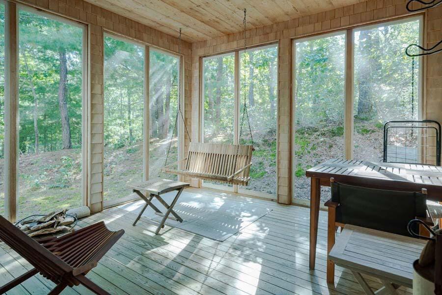 45 Old Long Pond Road Wellfleet, MA 02667 - Photo 4 of 47 a living room with furniture and a floor to ceiling window