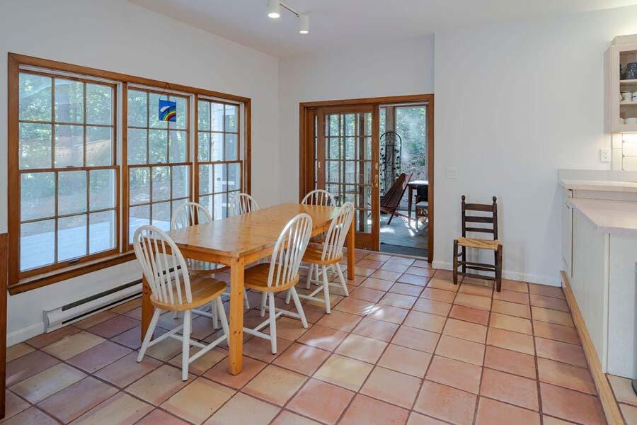 45 Old Long Pond Road Wellfleet, MA 02667 - Photo 8 of 47 a view of a dining room with furniture window and outside view
