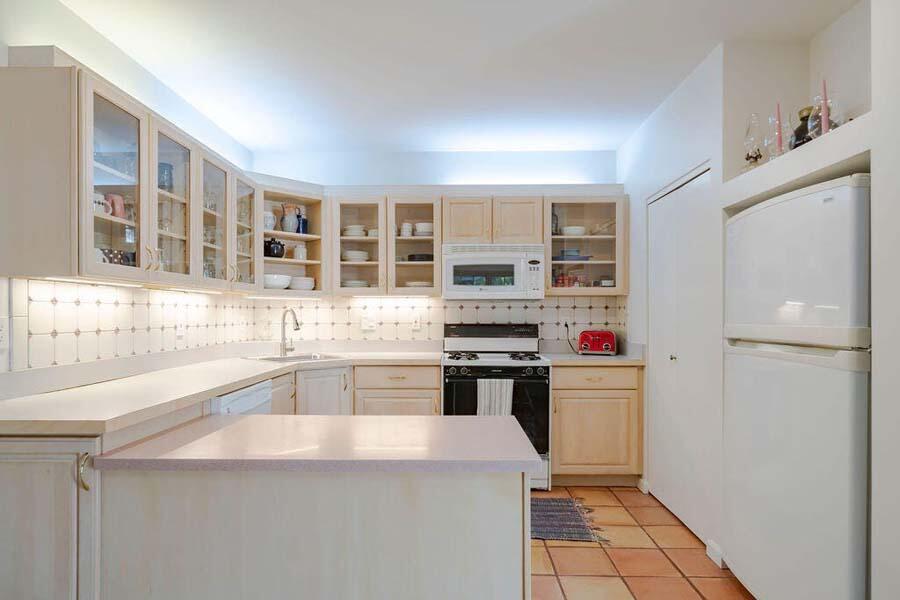 45 Old Long Pond Road Wellfleet, MA 02667 - Photo 9 of 47 a kitchen with stainless steel appliances a refrigerator and a stove top oven