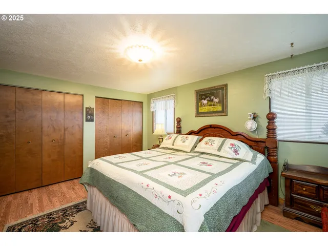 a bedroom with a bed and a table