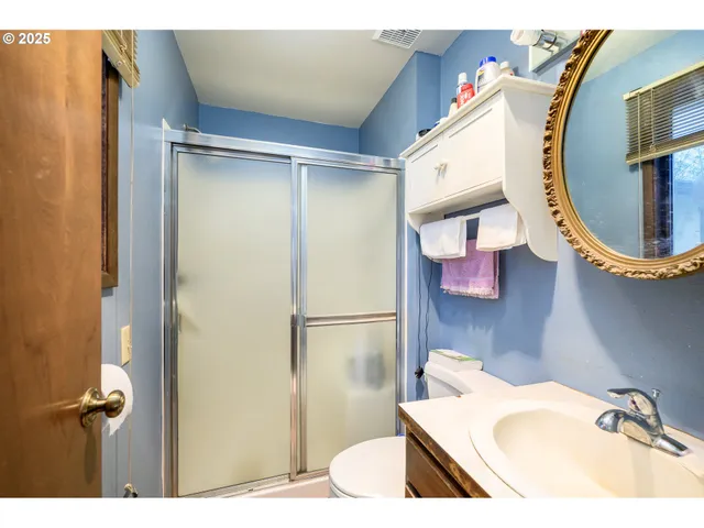 a bathroom with a sink and mirror