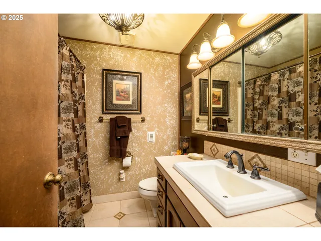 a bathroom with a sink vanity and a mirror