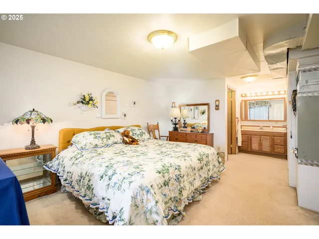 a bedroom with a bed and a cabinets