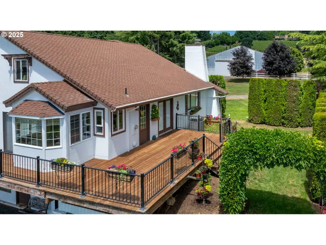 a balcony with table and chairs